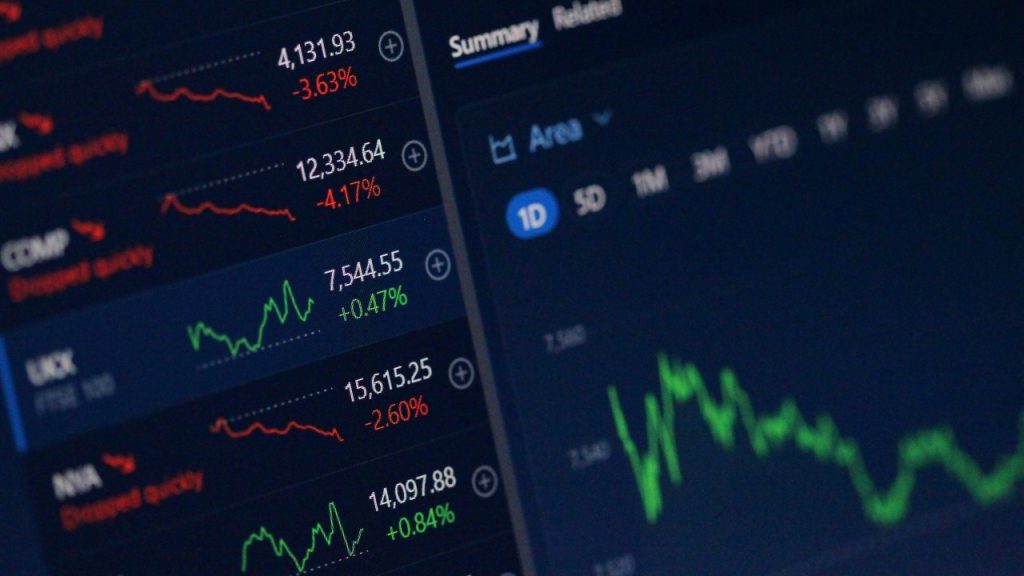 A close up image of graph lines and data showing growth and decline.